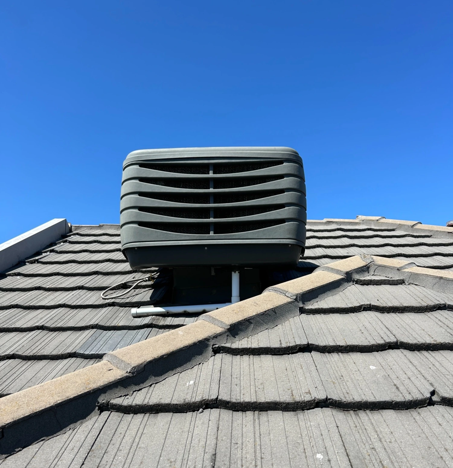 evaporative cooler on Melbourne roof.